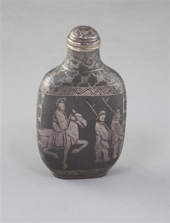 A Chinese iron and silver inlaid snuff bottle, late 19th/early 20th century, 7.3cm including stopper (no. 795)